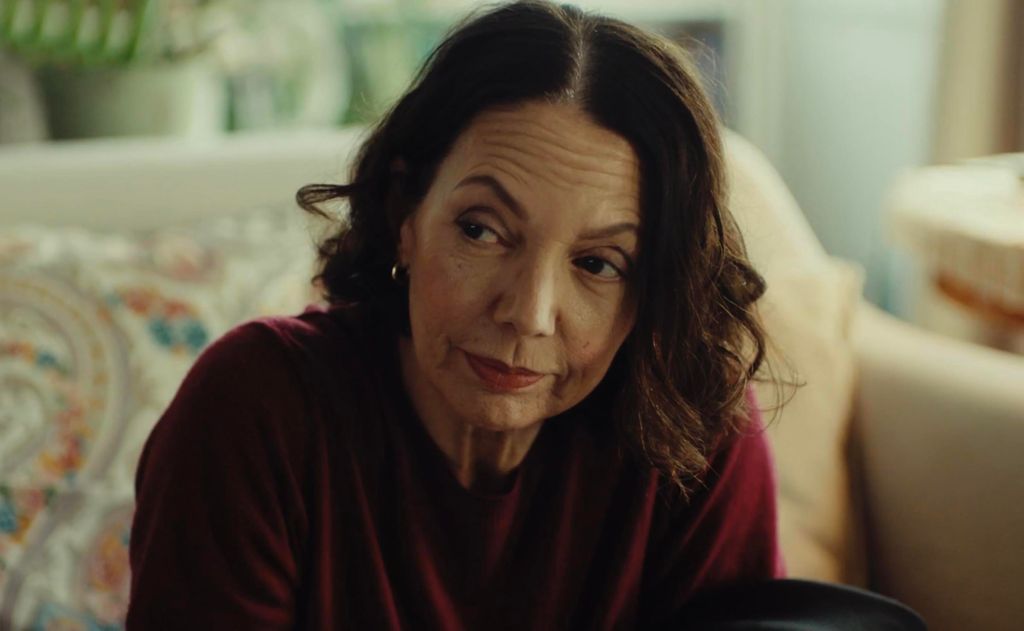 close-up of brunette woman sitting on sofa