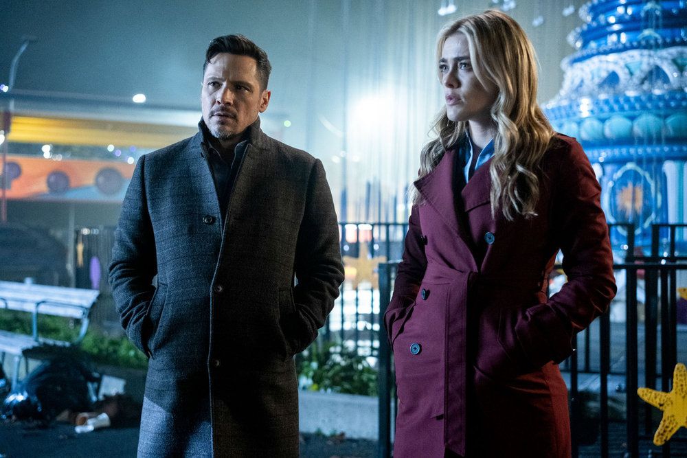 man and woman in coats standing outdoors