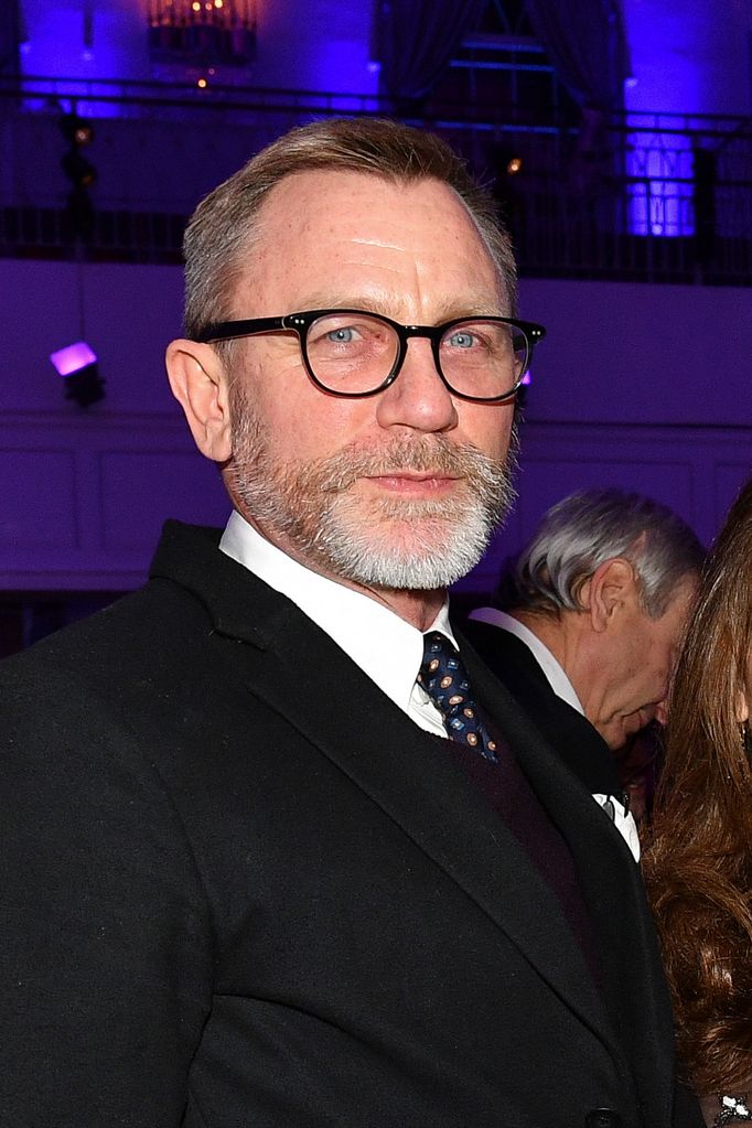 man with glasses in dark suit