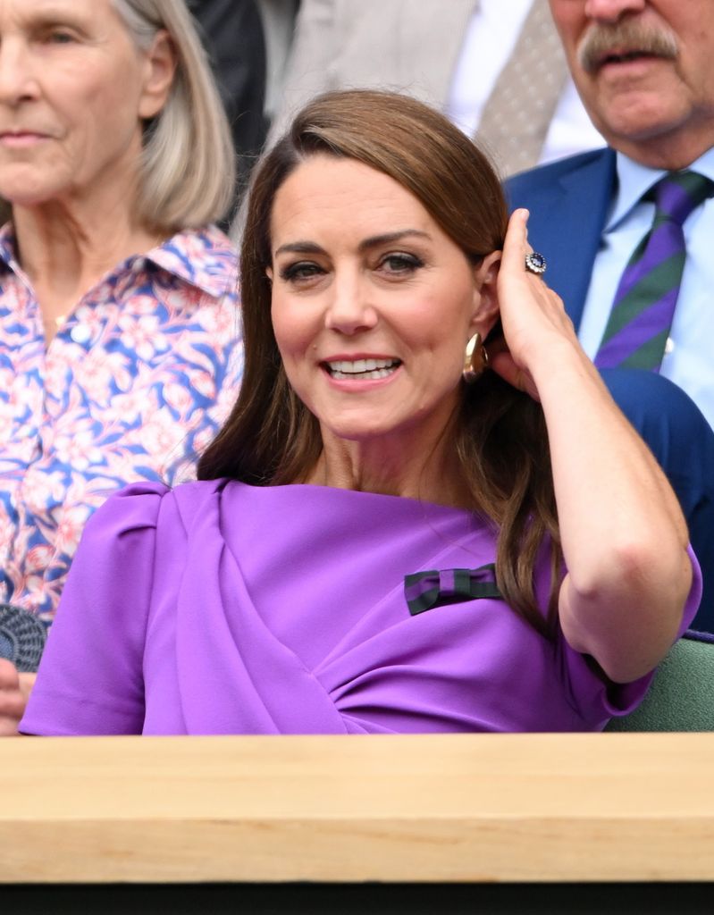 Kate Middleton brushes hair behind ear at Wimbledon