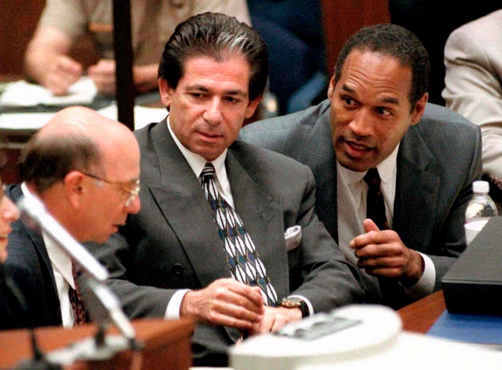 This 03 May, 1995 file photo shows murder defendant O.J. Simpson (R) consulting with friend Robert Kardashian (C) and Alvin Michelson (L), the attorney representing Kardashian, during a hearing in Los Angeles