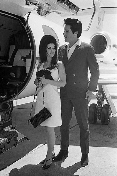 Elvis and Priscilla Presley boarding private jet