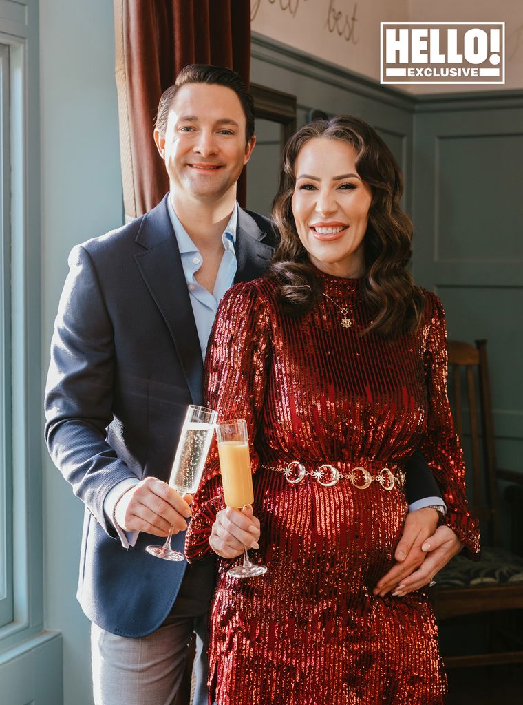 Ellie Phillips wearing red sparkly dress for pregnancy reveal with husband Robert Dee