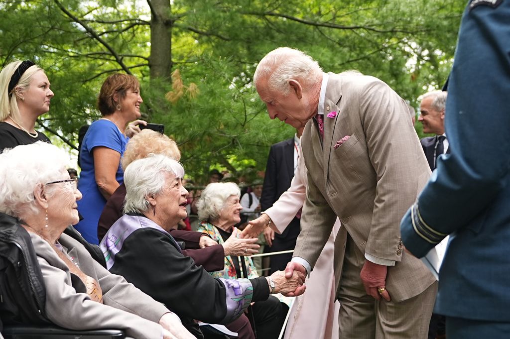 Charles shaking hands with Carol Shipley in Ottawa