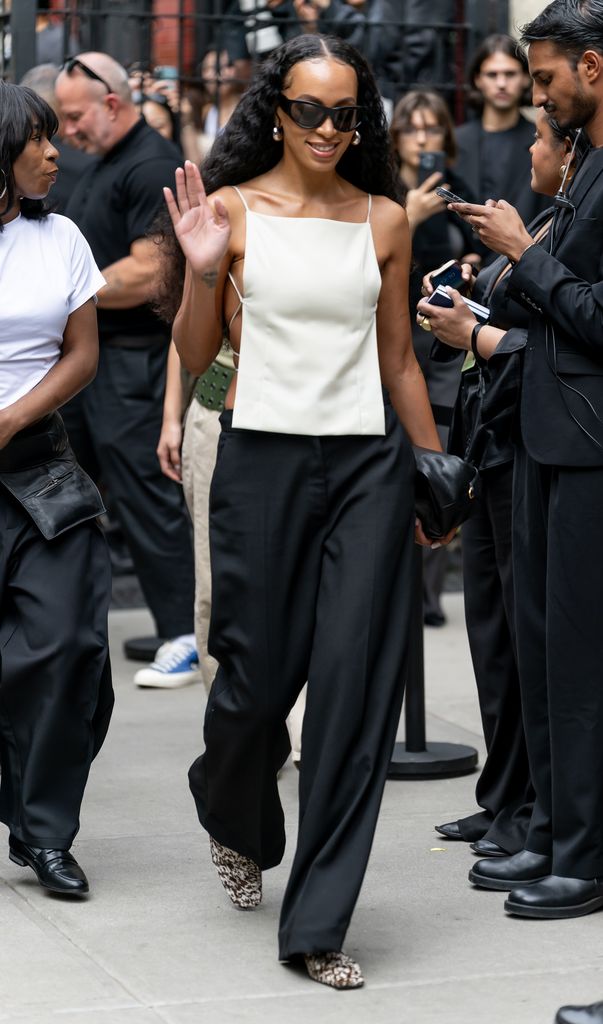 Solange Knowles is seen arriving at the Calvin Klein fashion show during New York Fashion Week inwhite top and black pants