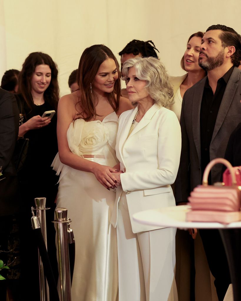 Jane Fonda in white with chrissy teigen at event