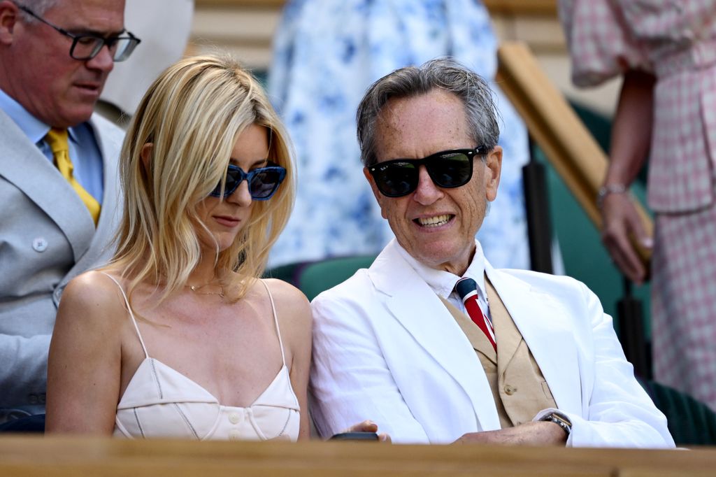 Richard E. Grant smiles from the Royal Box