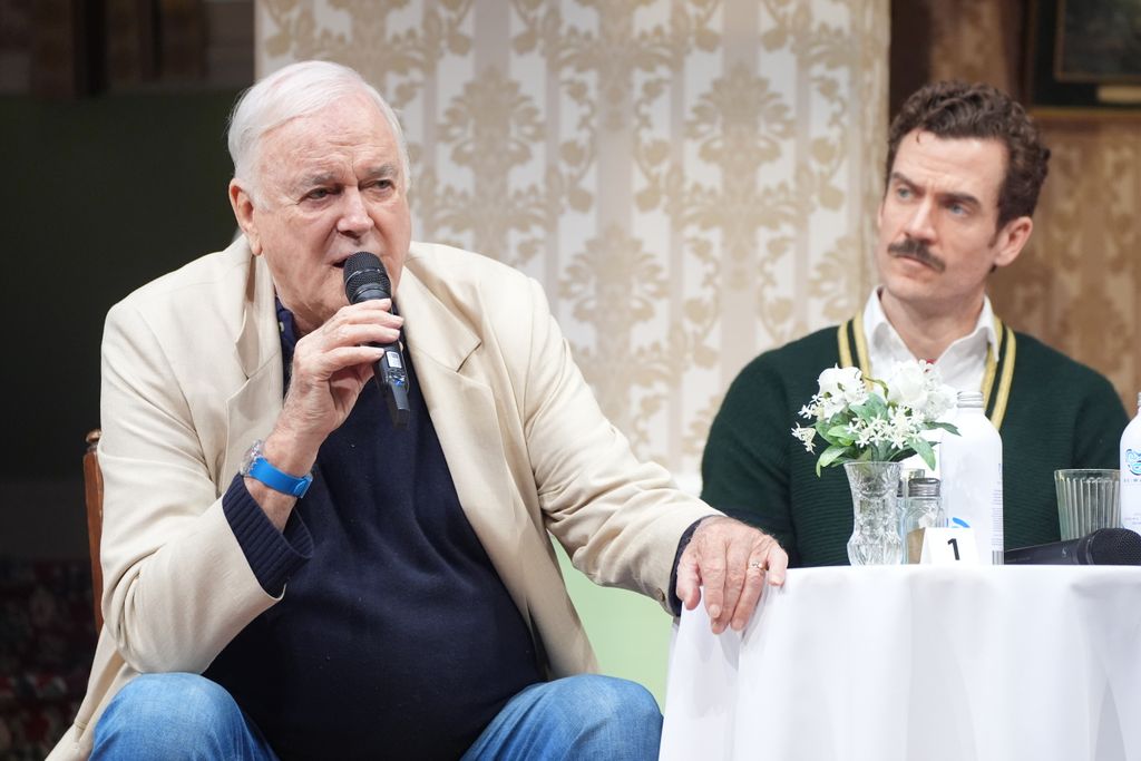 John Cleese and Adam Jackson-Smith as Basil Fawlty during a Q&A session 