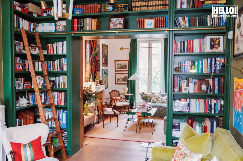 Nina Litchfield's green library with shelves stacked with colourful books at Notting Hill home