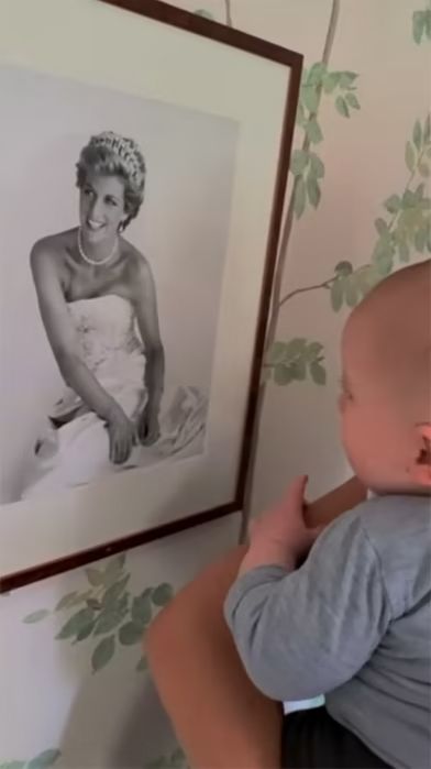 baby archie looking at diana photo in nursery