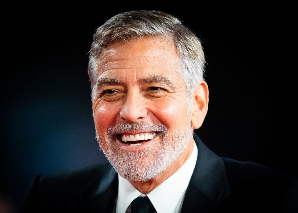 George Clooney smiling in suit 