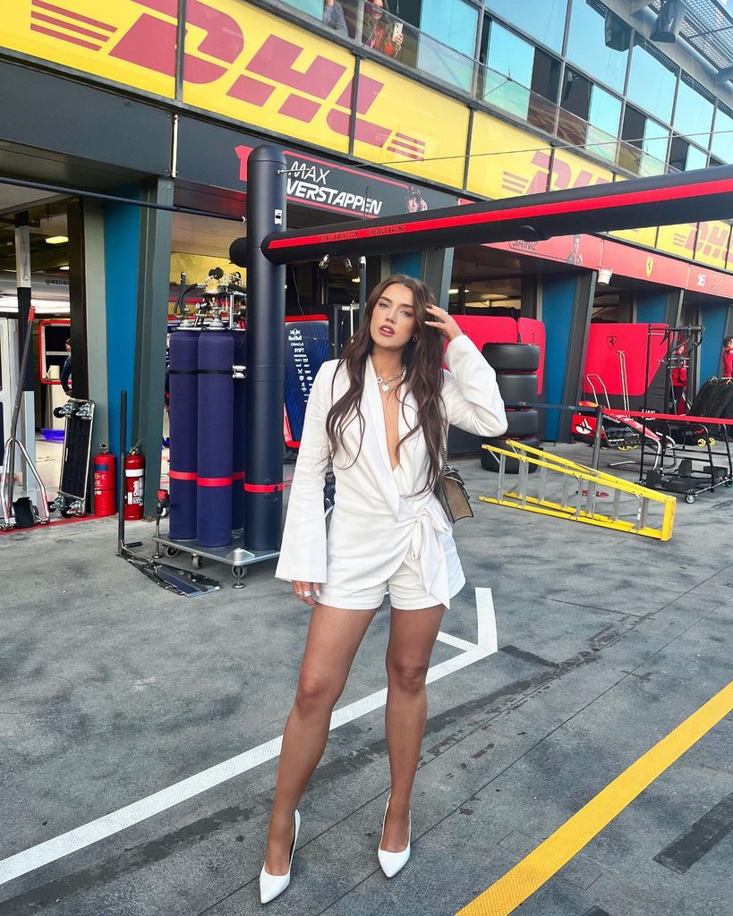 Missy in white jumpsuit at f1