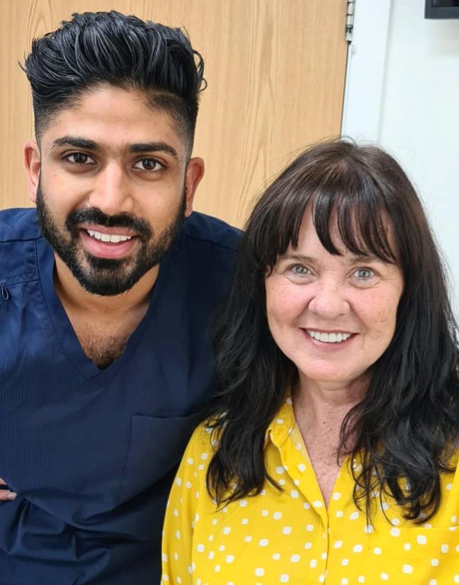 A dentist standing with Coleen Nolan
