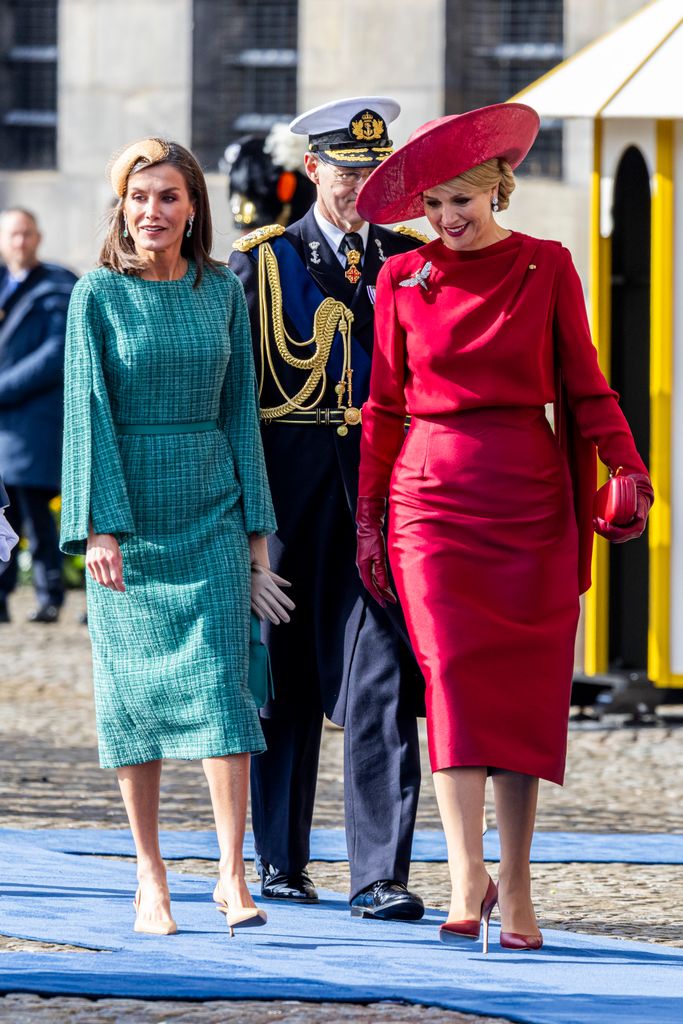 Queen Letizia in emerald green tweed walking with Queen Maxima