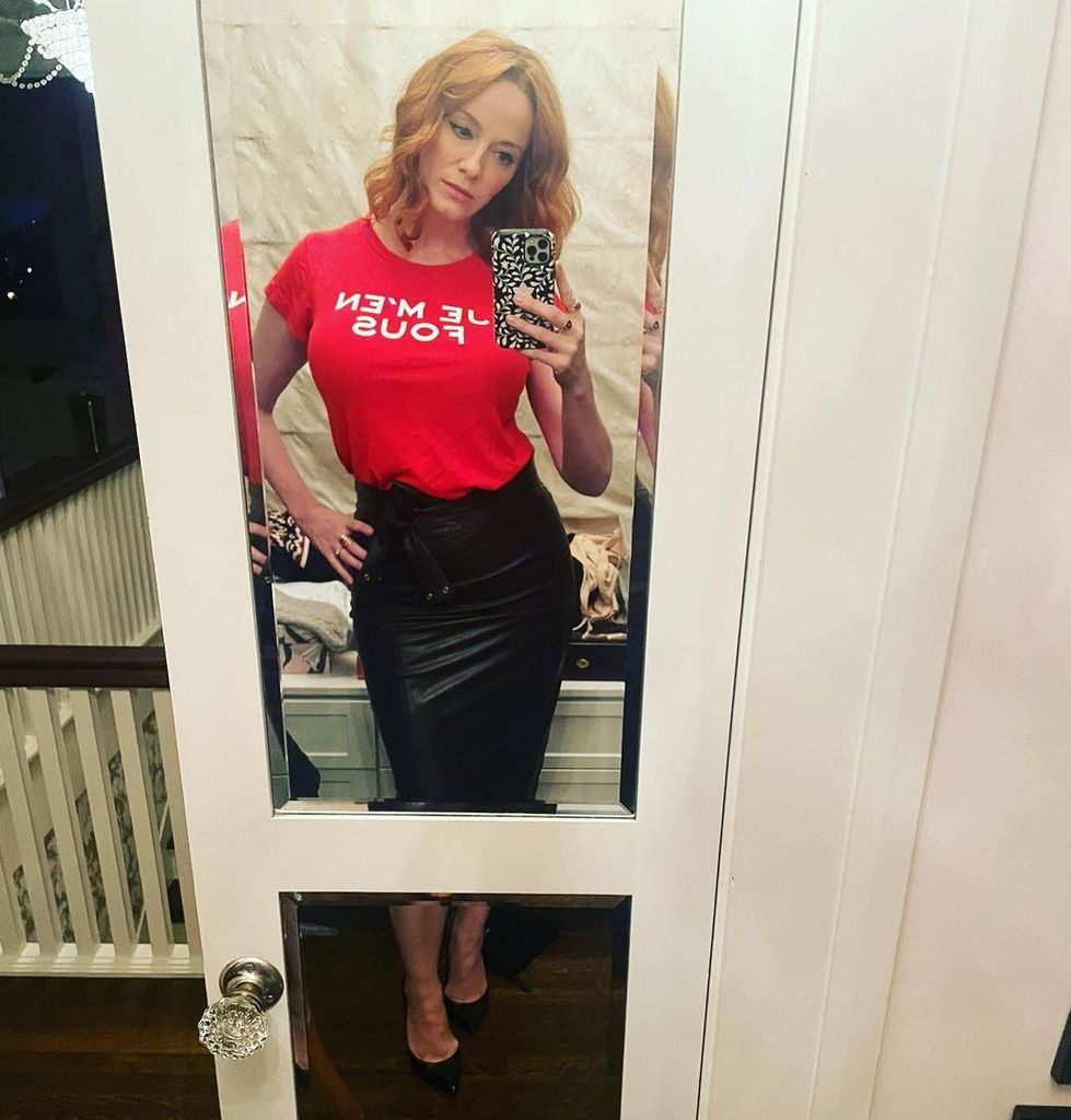 christina hendricks mirror selfie leather skirt red top