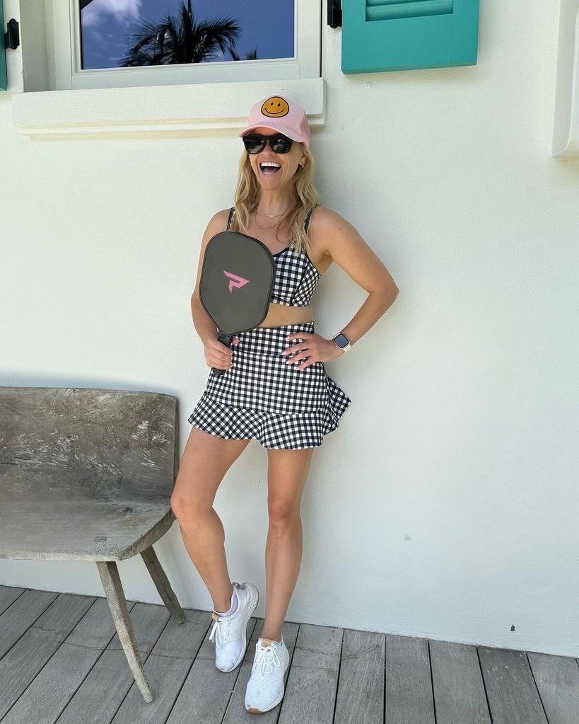 reese witherspoon wearing draper james pickle ball skorts