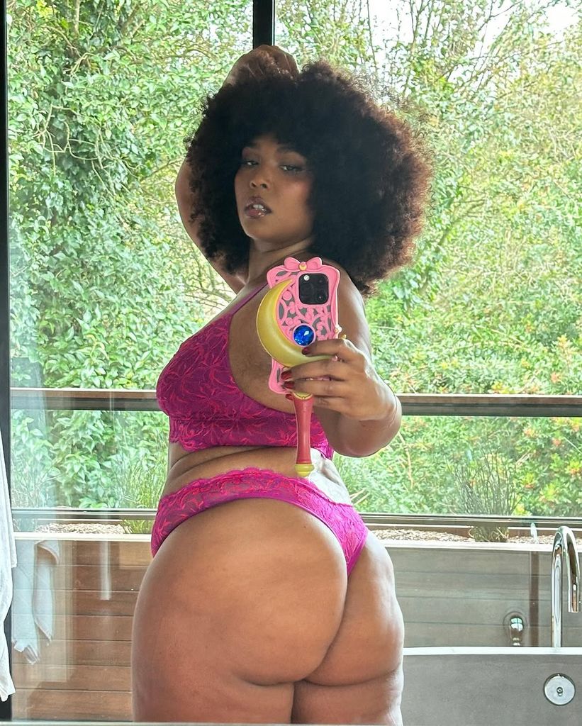 Selfie shared by Lizzo on Instagram wearing pink lingerie