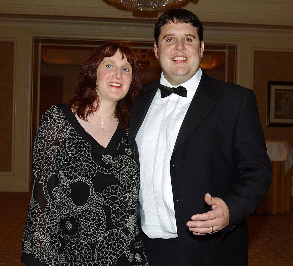 Peter Kay in a tuxe and wife Susan in a black patterned dress