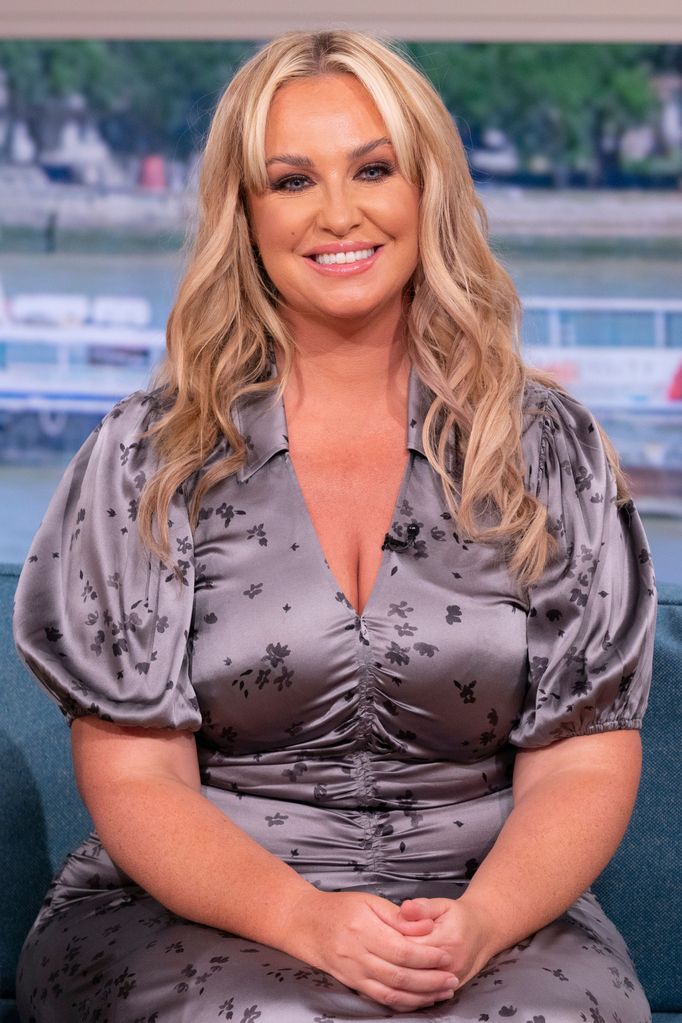 Josie Gibson sitting in silky outfit