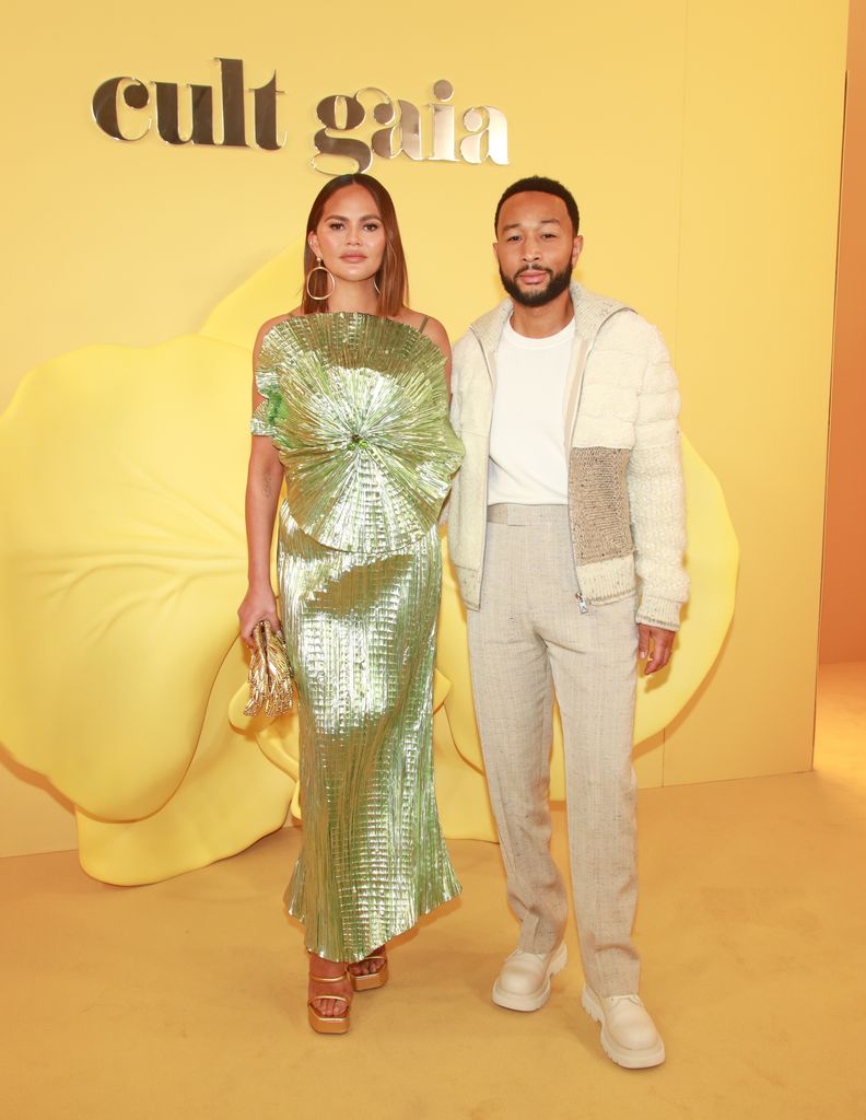 Chrissy teigen in green, john legend in off-white