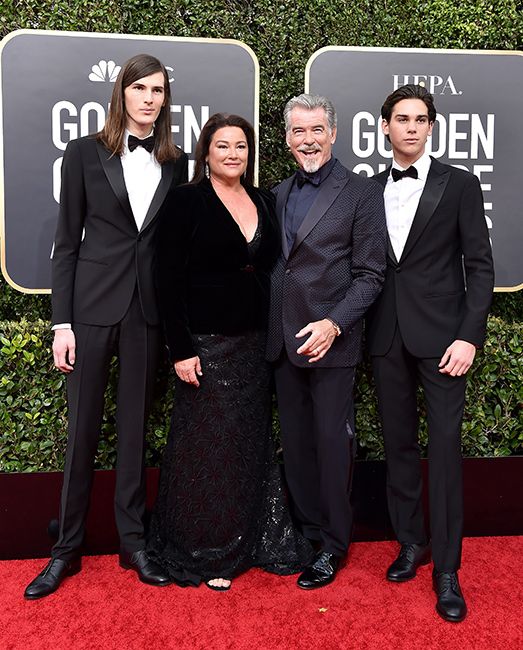 pierce brosnan and his wife keely pose with sons