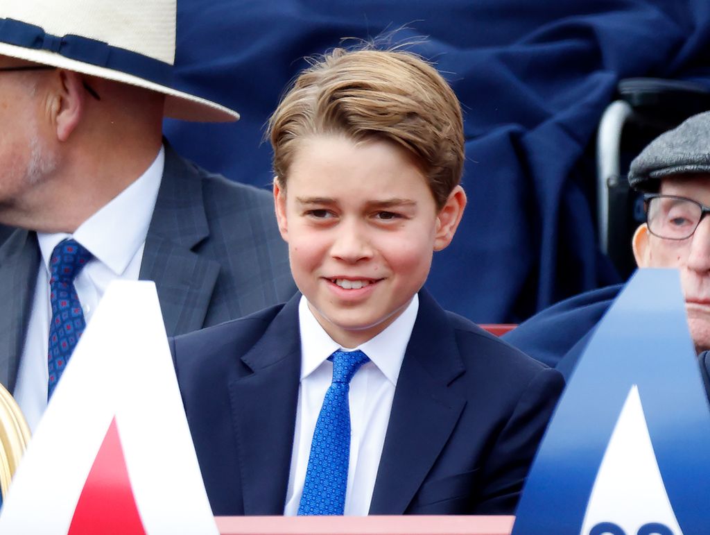 Prince George in a crowd of people