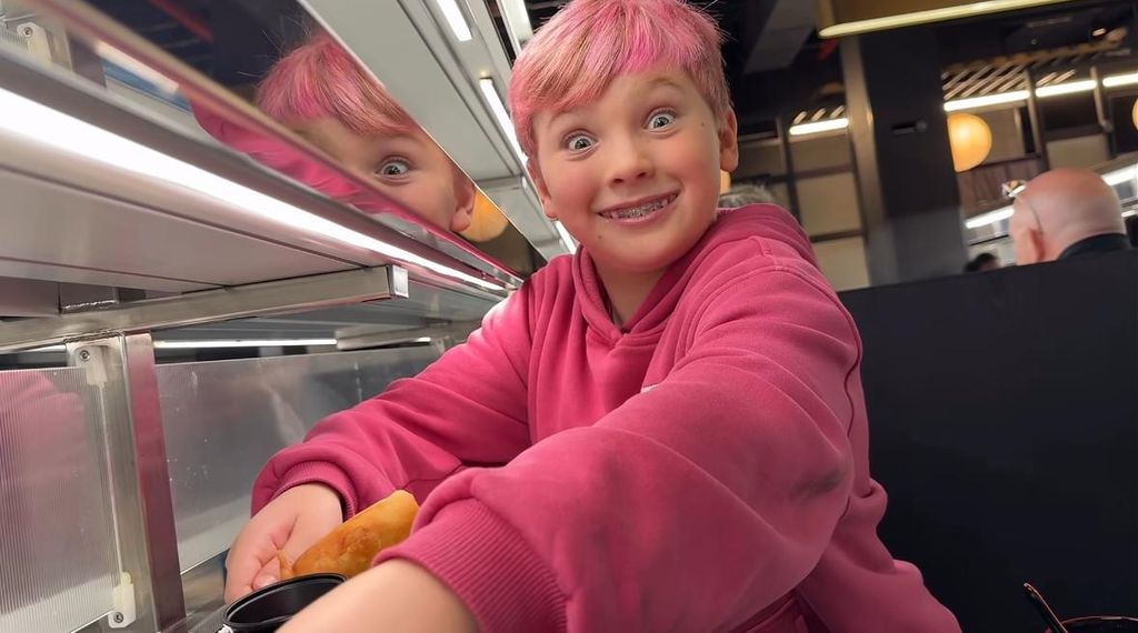 Pink and Carey Hart's son Jameson jokingly poses for a photo while grabbing conveyor belt sushi, shared in an Instagram video