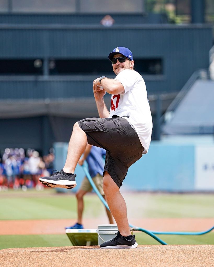Chris Pratt in Dodgers jersey and baseball cap pitching