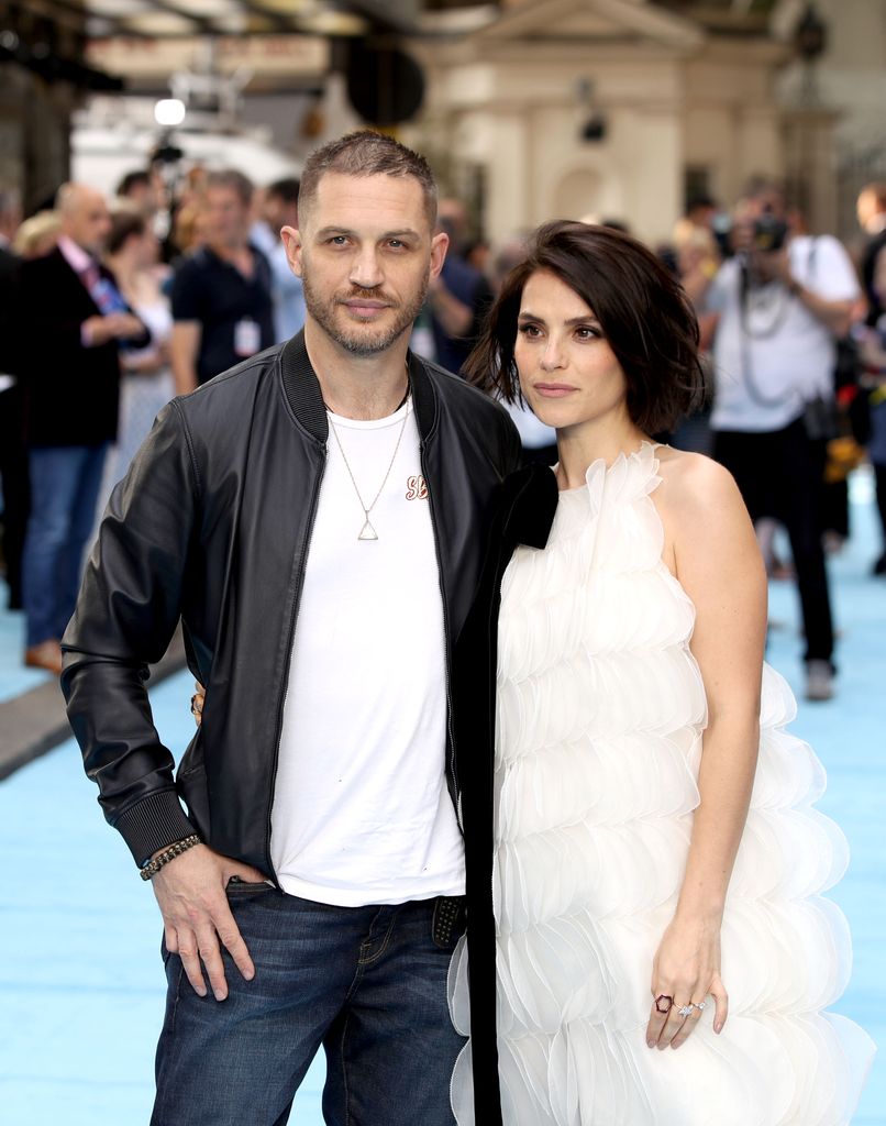 Tom Hardy standing with wife Charlotte Riley