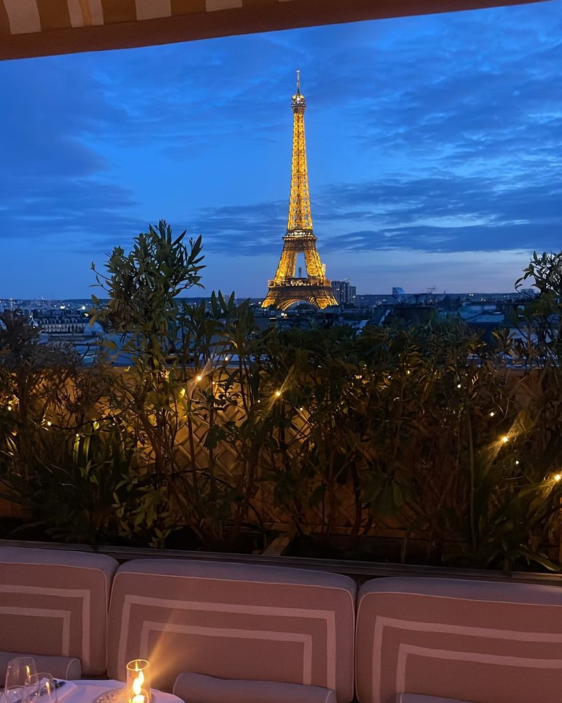 photo of rooftop restaurant overlooking eiffel tower