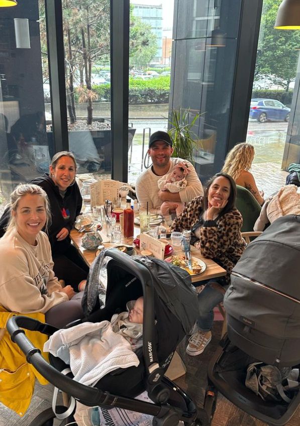 Gemma Atkinson, Aljaz Skorjanec, Janette Manrara and blonde woman sat around a table with two babies