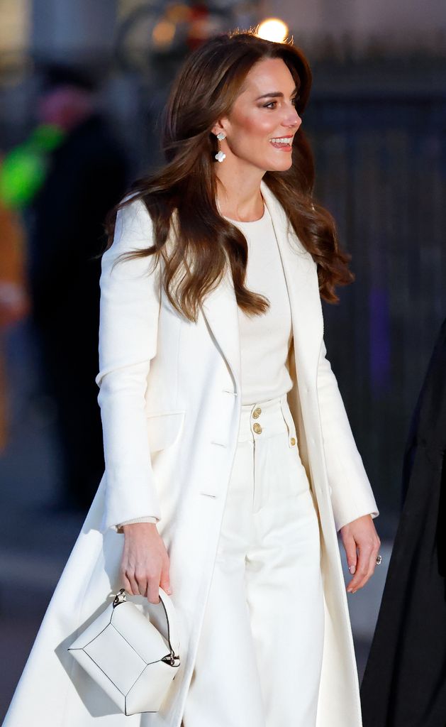 Kate was a vision in all-white as she accessorised with her Strathberry Nano bag in 2023