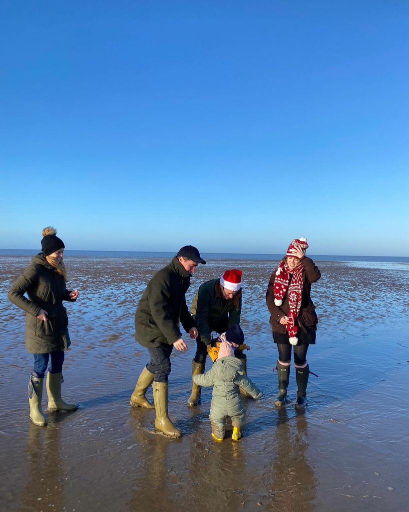 Beatrice, Edoardo, Jack and Eugenie playing on the beach with August and Sienna at Christmas 2022