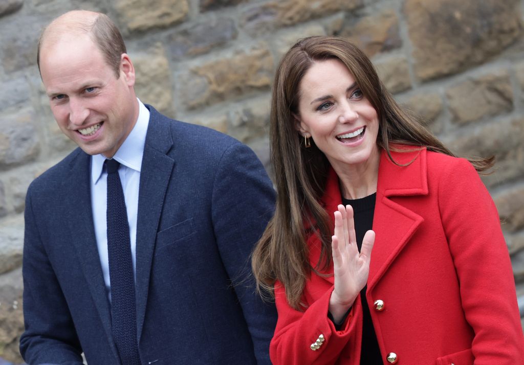 William and Kate, wearing red coat in Swansea