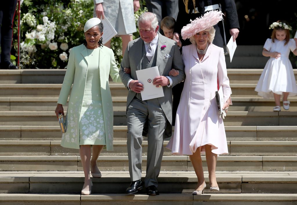 Charles offering his arm to Doria Ragland and Queen Consort Camilla after the wedding of Prince Harry and Meghan Markle 