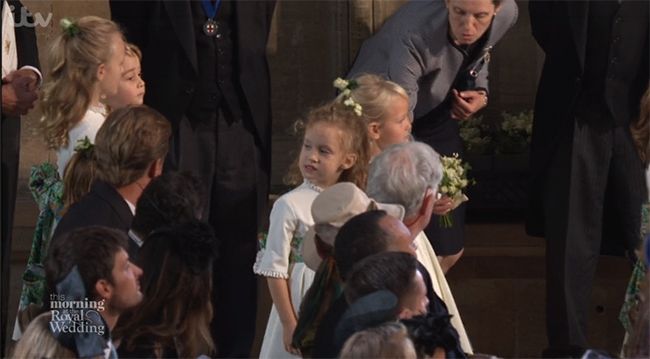 royal nanny handing flowers at royal wedding