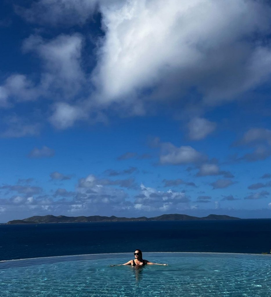 Photo shared by Mariska Hargitay on Instagram April 2024 posing in an infinity pool with the ocean as a backdrop while on vacation