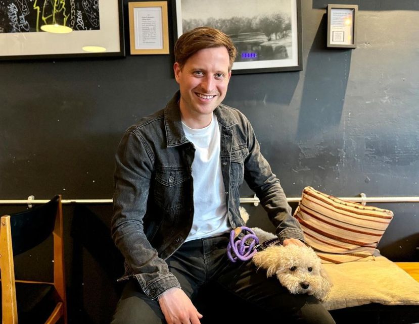 Nicholas Ralph with a dog