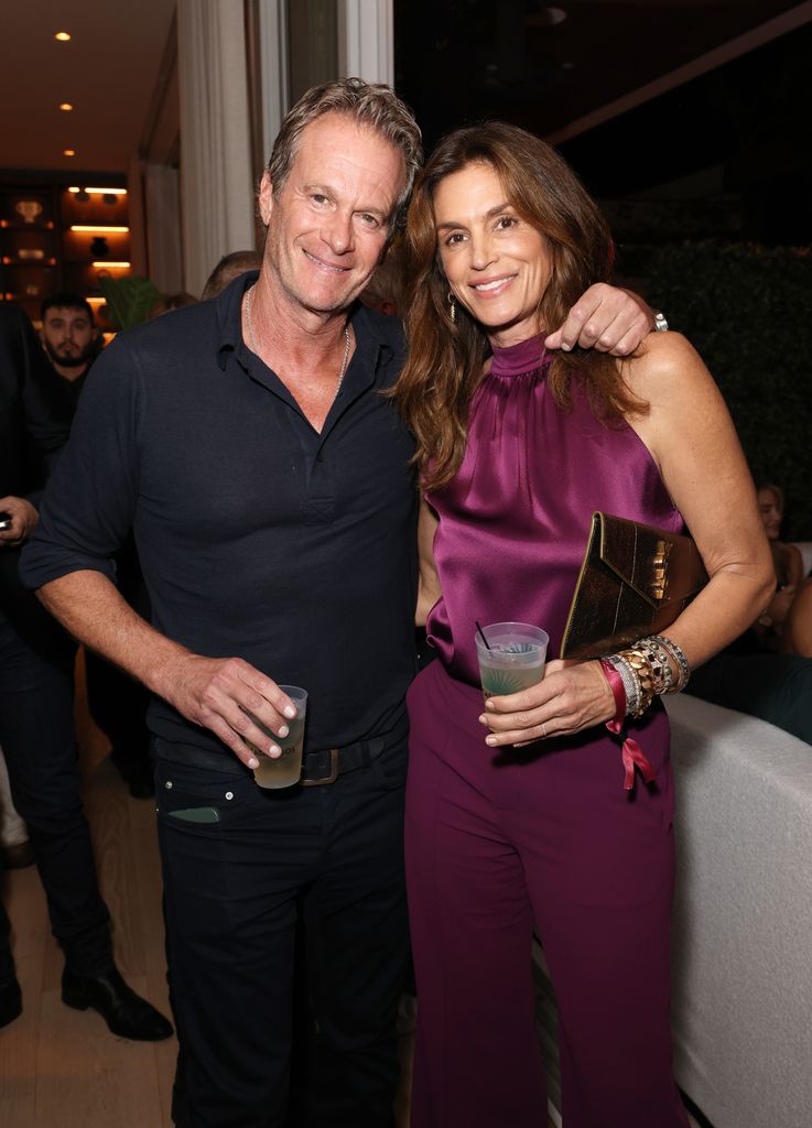 MIAMI BEACH, FLORIDA - DECEMBER 08: (L-R) Rande Gerber and Cindy Crawford attend Wayne & Cynthia Boich's Art Basel party on December 08, 2023 in Miami Beach, Florida. (Photo by Alexander Tamargo/Getty Images for 4WRD)