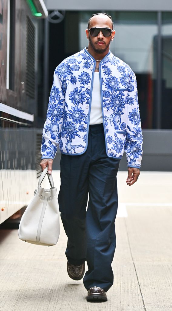 Lewis Hamilton of Great Britain and Mercedes arrives in the paddock during previews ahead of the F1 Grand Prix of Great Britain at Silverstone Circuit on July 4, 2024 in Northampton, England.(Photo by Vince Mignott/MB Media/Getty Images)