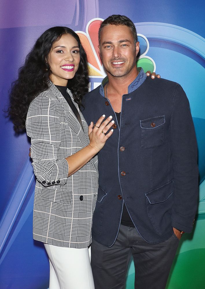 Miranda Rae Mayo and Taylor Kinney pose together at an NBC event 