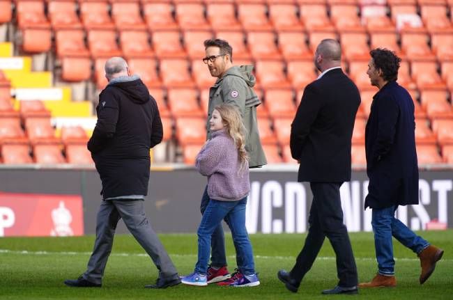 Ryan Reynolds with his daughter James at Wrexham soccer stadium