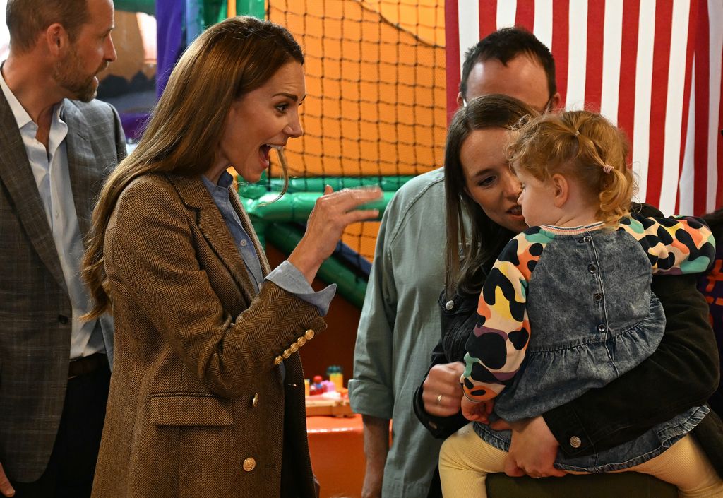 Kate cooed over a toddler at the community centre