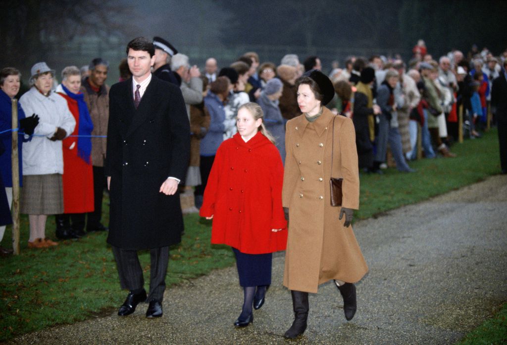 Princess Anne walks to a Christmas church service at Sandringham with her husband Timothy Laurence and daughter Zara Phillips