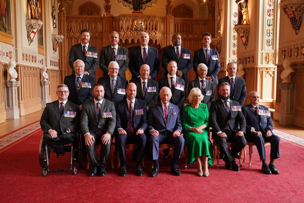 group photo taken in windsor castle featuring Prince William, King Charles and Queen Camilla 