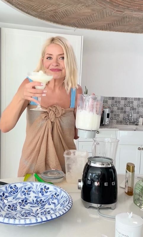 Holly Willoughby holding a cocktail
