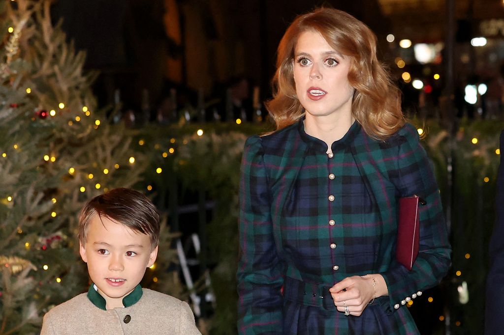 Britain's Princess Beatrice of York (C), her husband Edoardo Mapelli Mozzi (R) and stepson Christopher (L) arrive for the "Together At Christmas" Carol Service" at Westminster Abbey in London on December 8, 2023. Th