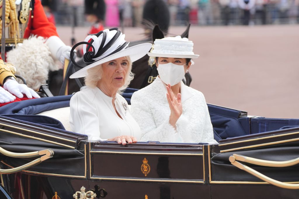 Queen Camilla with Empress Masako of Japan arriving at Buckingham Palace during the ceremonial welcome 