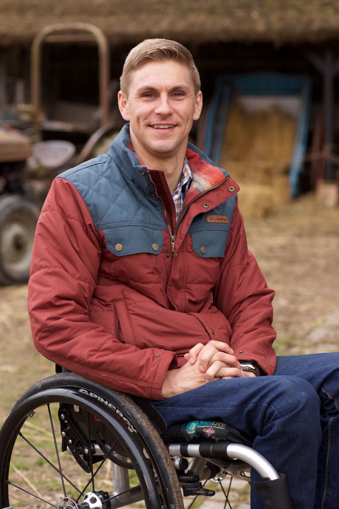 Steve Brown in a wheelchair on a farm