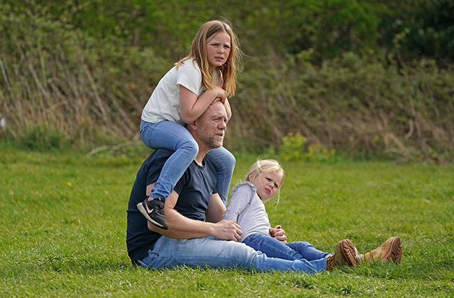 Mike Tindall with his daughters Lena and Mia sitting on him